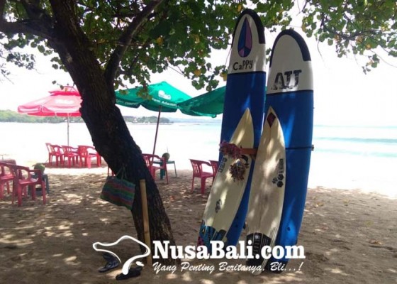 Nusabali.com - pasang-harga-pandemi-penjual-jasa-di-pantai-kuta-masih-sepi-pelanggan