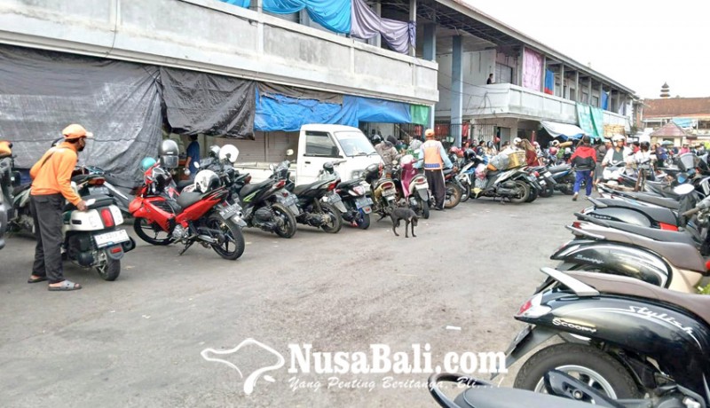 www.nusabali.com-tukang-parkir-wajib-ikut-bpjs-ketenagakerjaan