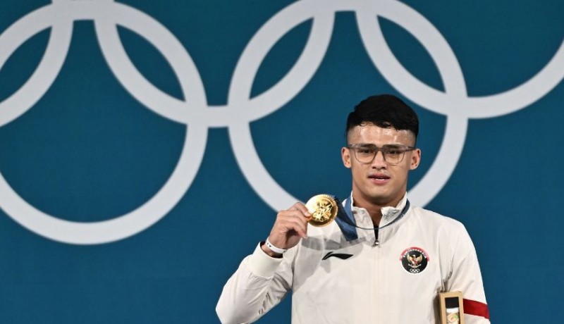 www.nusabali.com-rizki-juniansyah-raih-emas-di-olimpiade-paris-2024-cetak-sejarah-baru-bagi-indonesia