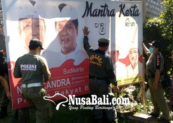 Nusabali.com - pol-pp-turunkan-baliho-cagub-cawagub